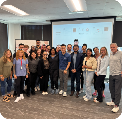 wankim and franchisees posing for picture in a meeting room after a presentation